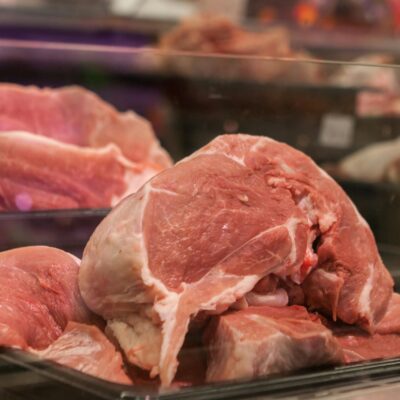 close-up-of-fresh-raw-pork-cuts-on-display-in-a-glass-case-at-a-market.-8251005-scaled-1.jpg